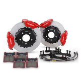 Complete TTSPORT DRT4+4 rear wheel drift brake kit, showing the two 4-piston forged calipers, slotted 2-piece rotor, performance pads, and steel-braided brake lines.