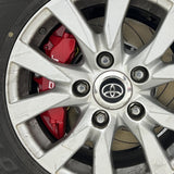 A red TTSPORT Toyota Tundra & Sequoia 6-piston big brake kit is installed on the front wheel.