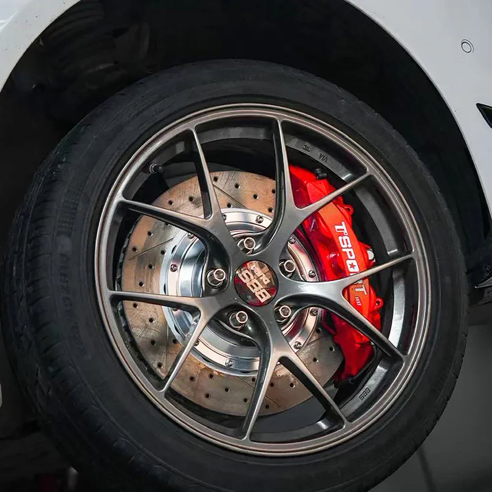 A red TTSPORT 8657S 6-piston big brake kit is installed on the 17" front wheel.