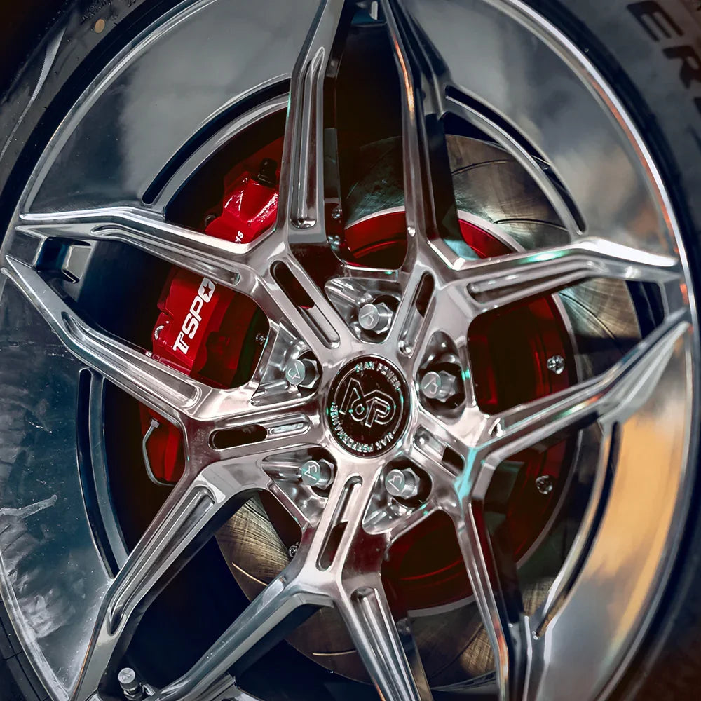 A red TTSPORT EB10 10-piston big brake kit is installed on the 22" front wheel.