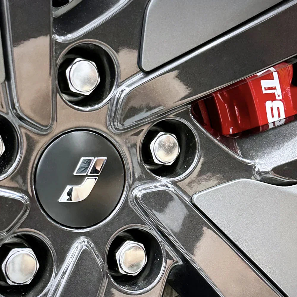 A red TTSPORT EB8 8-piston big brake kit is installed on the 21" front wheel.