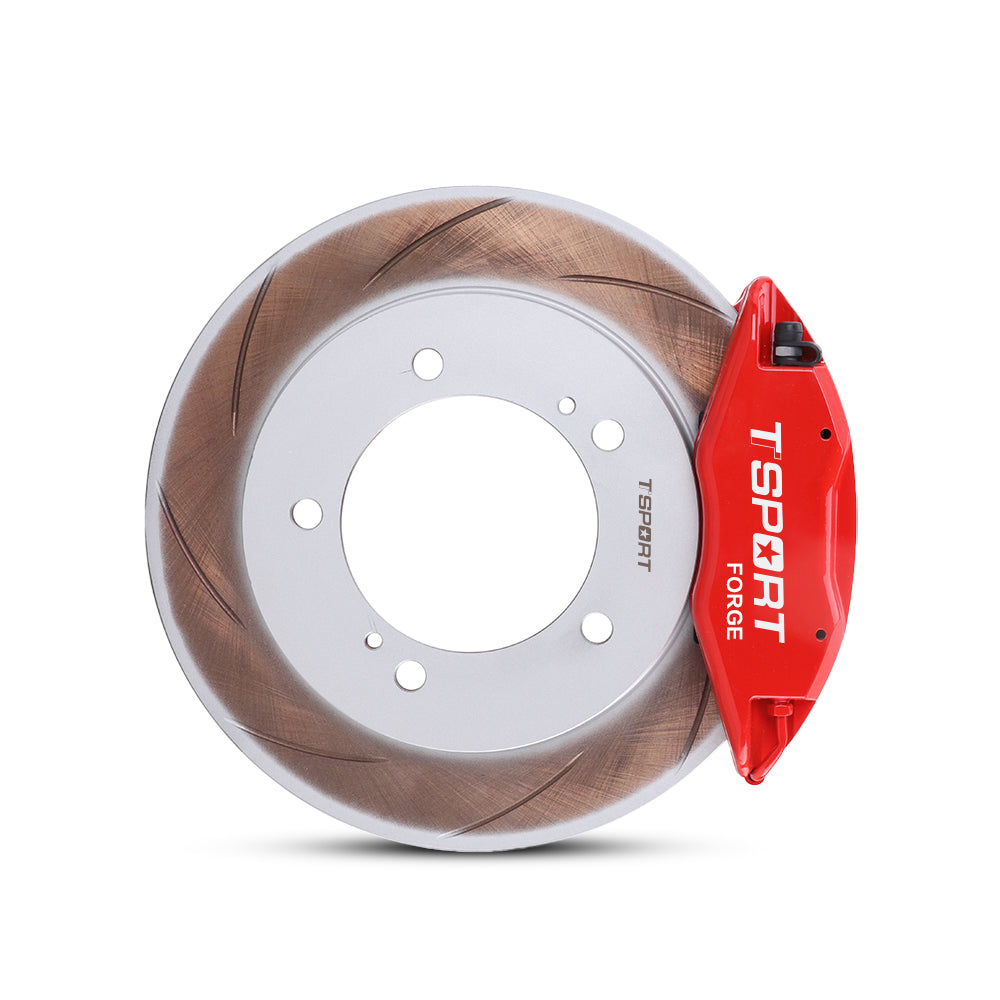 Close-up of a red TTSPORT Suzuki Jimny 4-piston forged brake caliper for the front wheel and a slotted rotor.