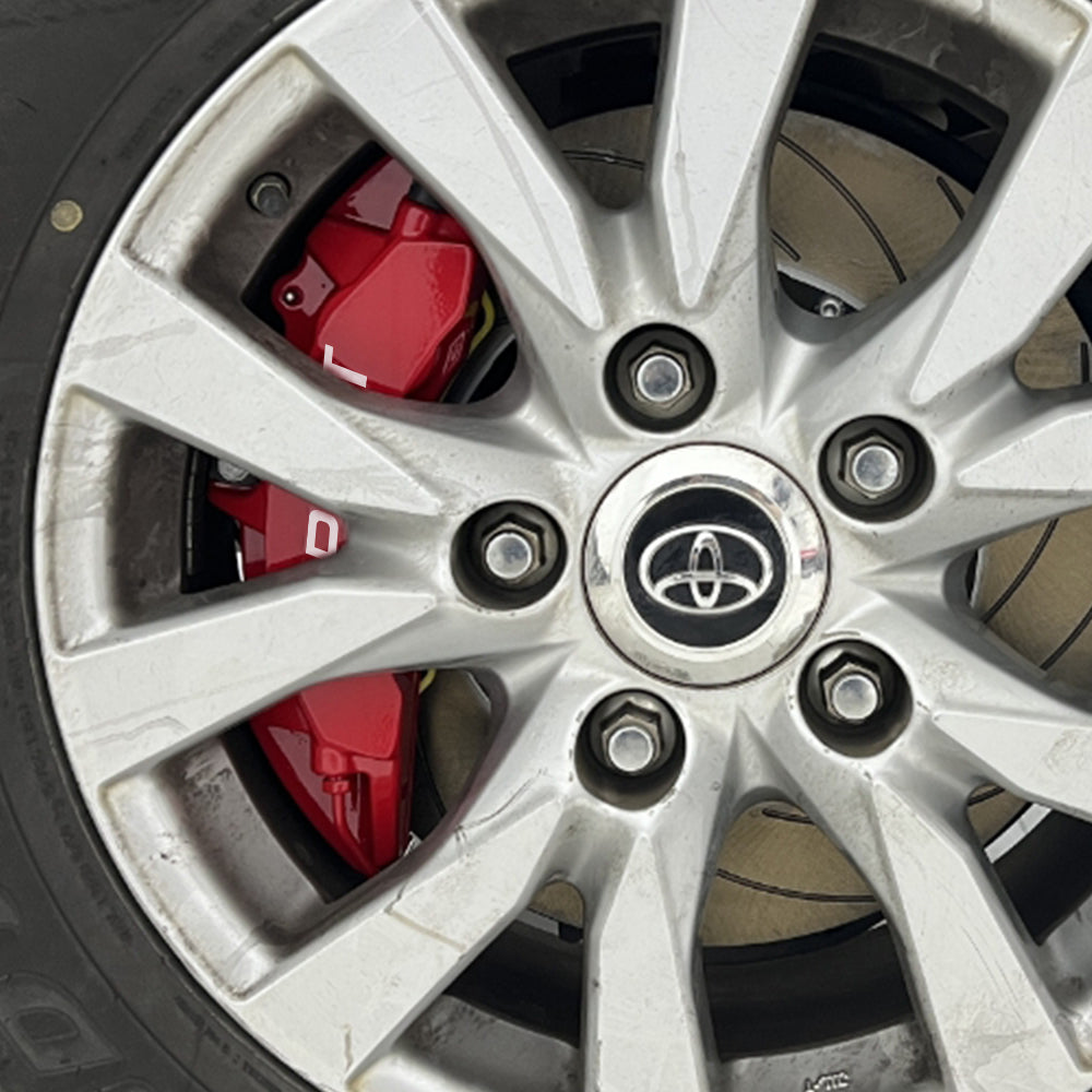 A red TTSPORT Toyota LC150 Prado 6-piston big brake kit is installed on the front wheel.